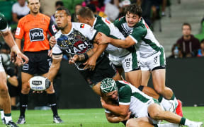 Will Chambers offloads for the Indigenous All Stars during their 2019 clash with the Maori All Stars.