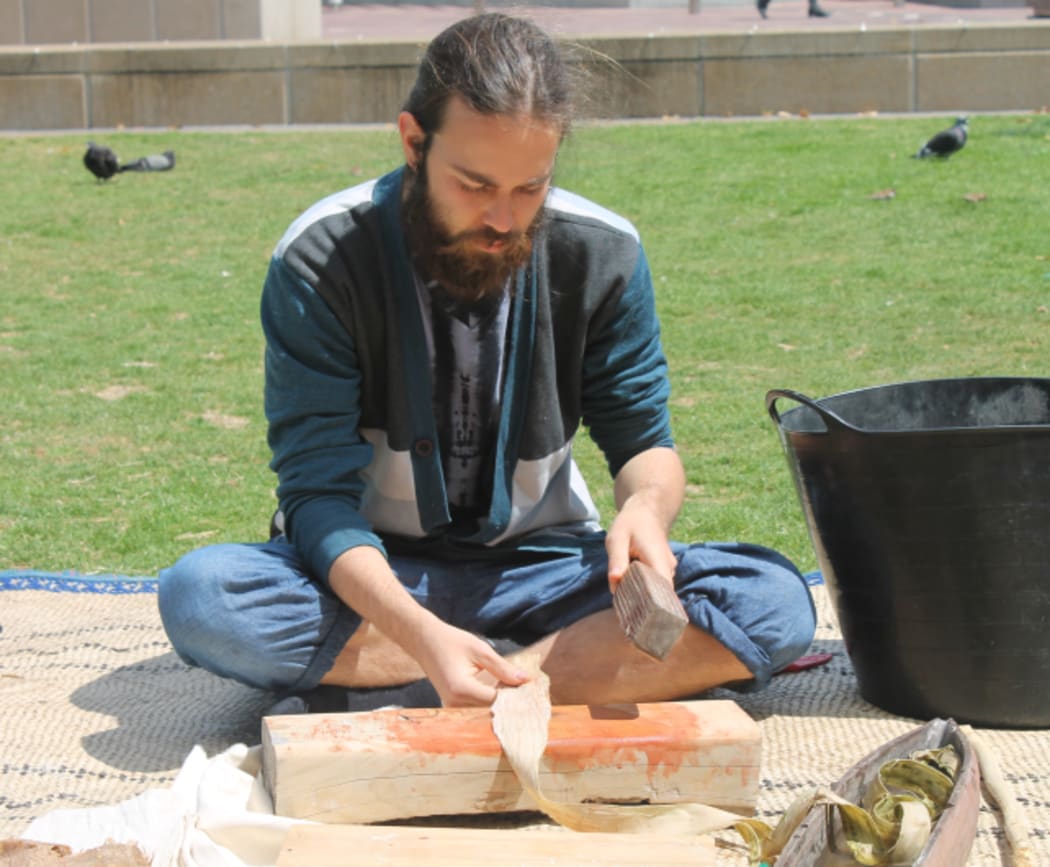 An image of a student working on a strip of aute.