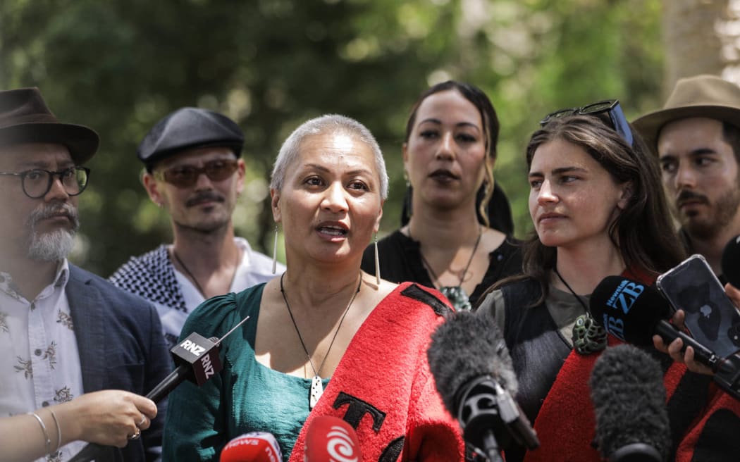 Marama Davidson speaks to media at Waitangi