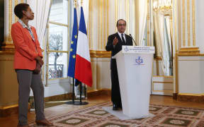 French President François Hollande addresses leaders from Wallis and Futuna at the Elysee Paris in Paris. The French overseas territories minister, George Pau-Langevin is also pictured.