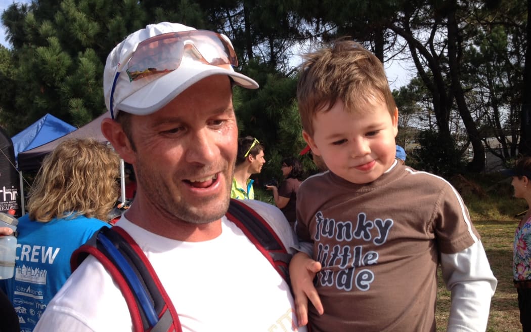 Aaron Carter, owner of the event company Total Sport, with his child