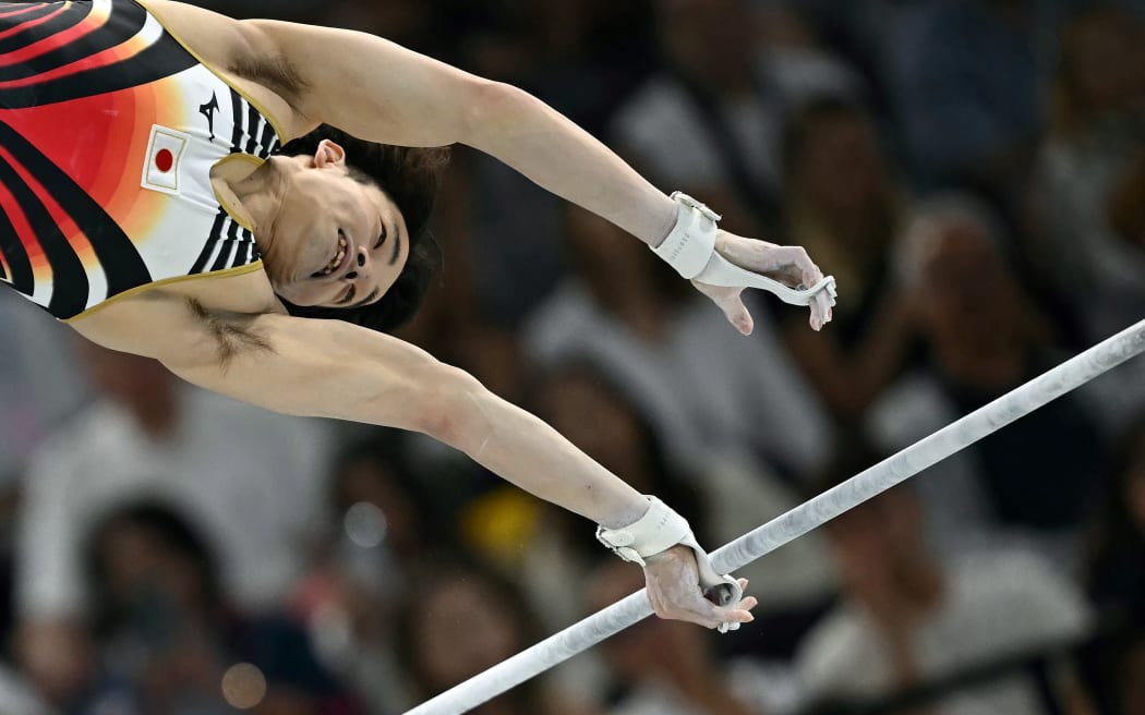 Japan's Shinnosuke Oka competes in the artistic gymnastics men's horizontal bar final during the Paris 2024 Olympic Games at the Bercy Arena in Paris, on August 5, 2024. (Photo by Paul ELLIS / AFP)