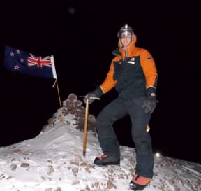 Mike Rowe on Crater Hill in Antarctica with the axe signed by Sir Edmund Hillary.