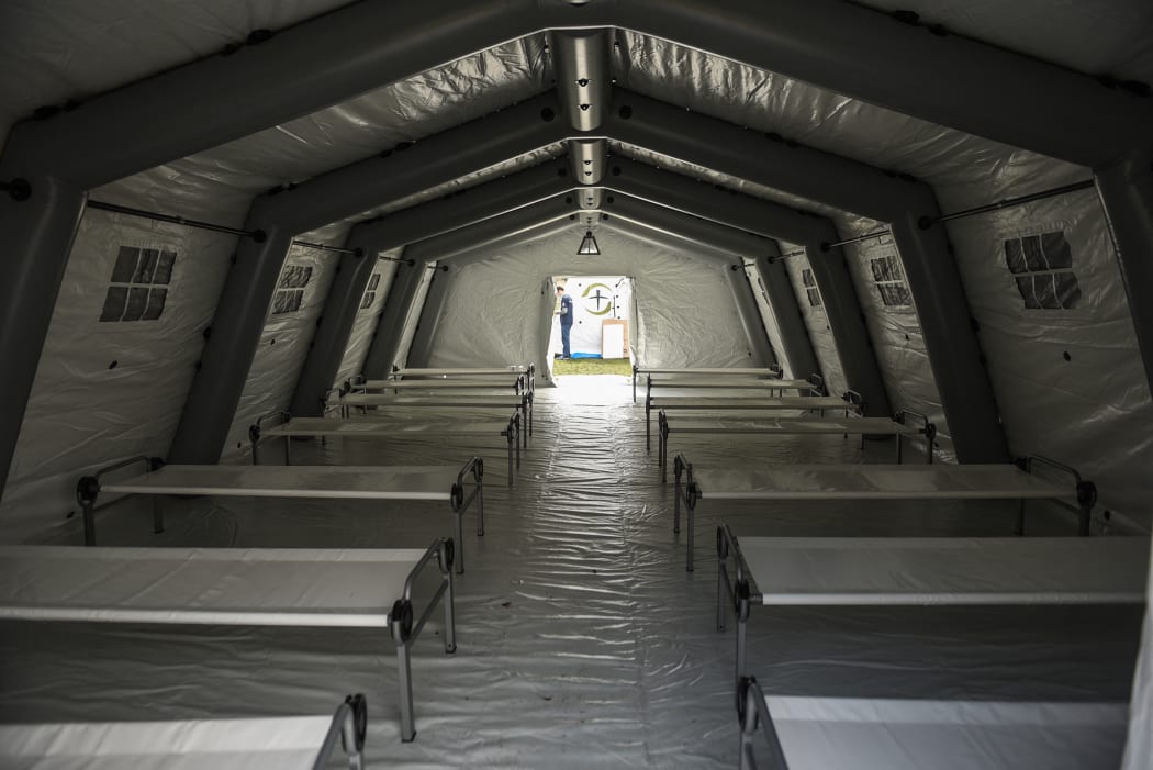 Hospital beds set up in an emergency field hospital tent in Central Park New York, to serve as a respiratory unit, in 2020.