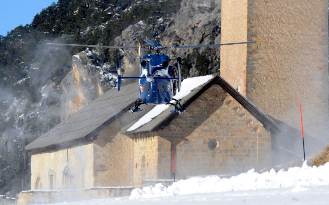 An helicopter of the French Gendarmerie arrives in Ceillac transporting the body of one of the six avalanche victims.