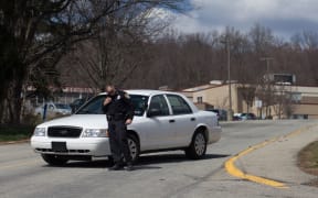 A police officer outside Franklin Regional Senior High School.