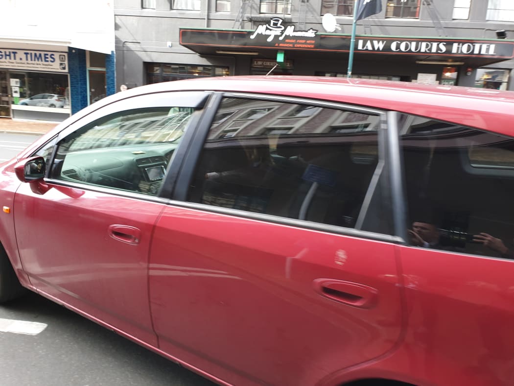 Barry Kloogh is driven away after appearing at Dunedin District Court.