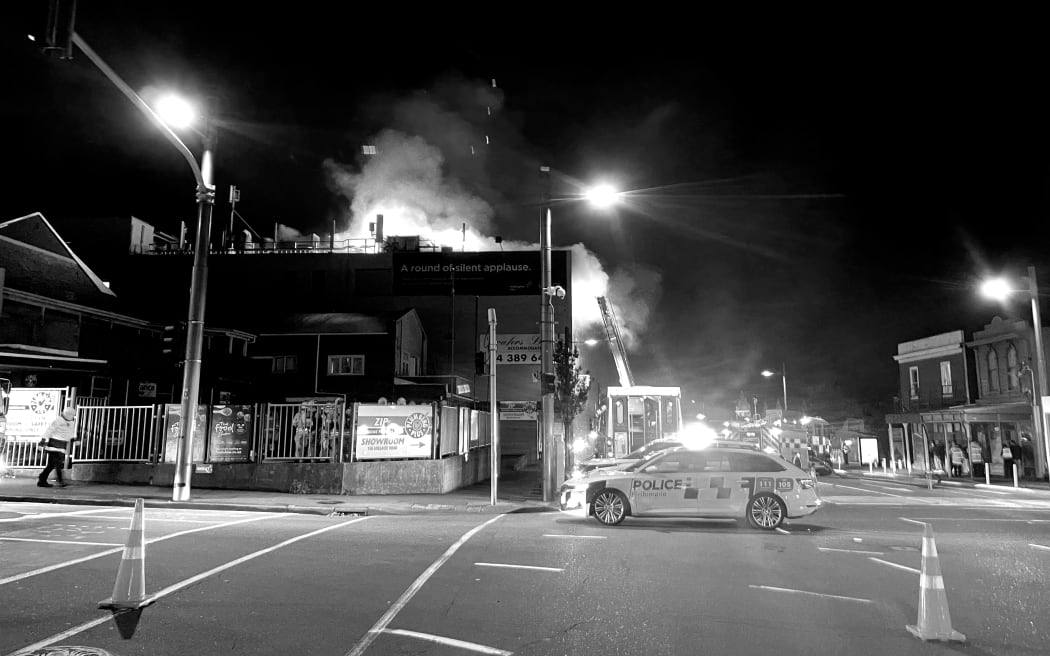 Emergency responders at Loafers Lodge in black and white