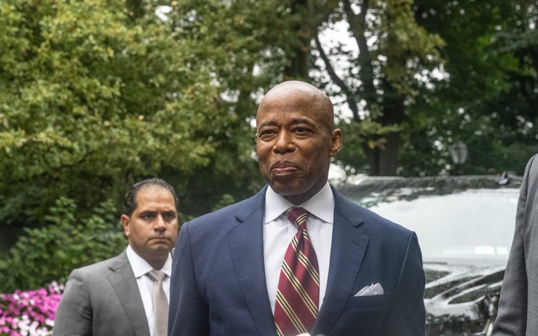 New York City Mayor Eric Adams stands with his lawyer Alex Spiro (R) who delivered remarks to the press on September 26, 2024 in New York City. Adams has been charged with five offenses: conspiracy to commit wire fraud, federal program bribery, solicitation of a contribution by a foreign national, wire fraud, and bribery.