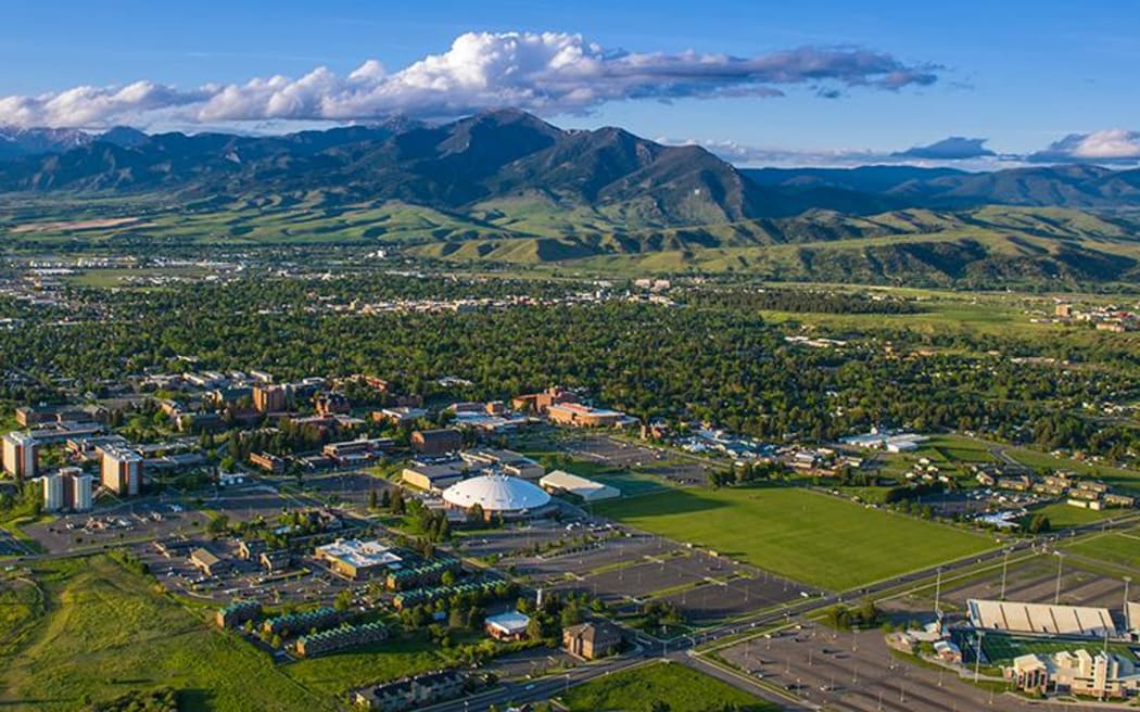 A photograph of the Bozeman, Montana with a mountain range in the background.
