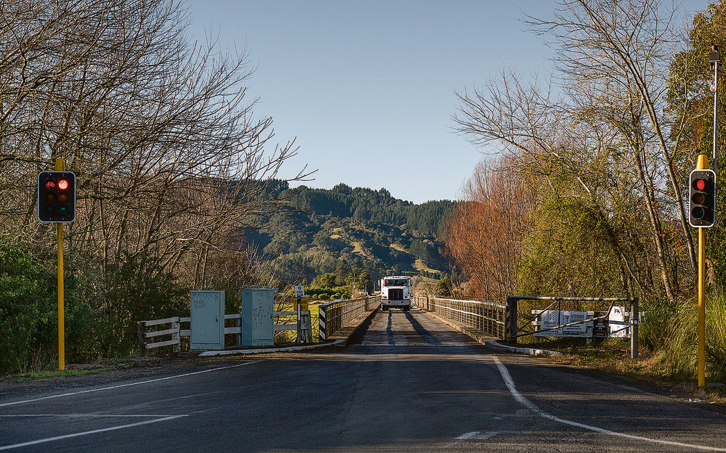 A heavy vehicle bumping its way across the Pekatahi Bridge surface on Wednesday.