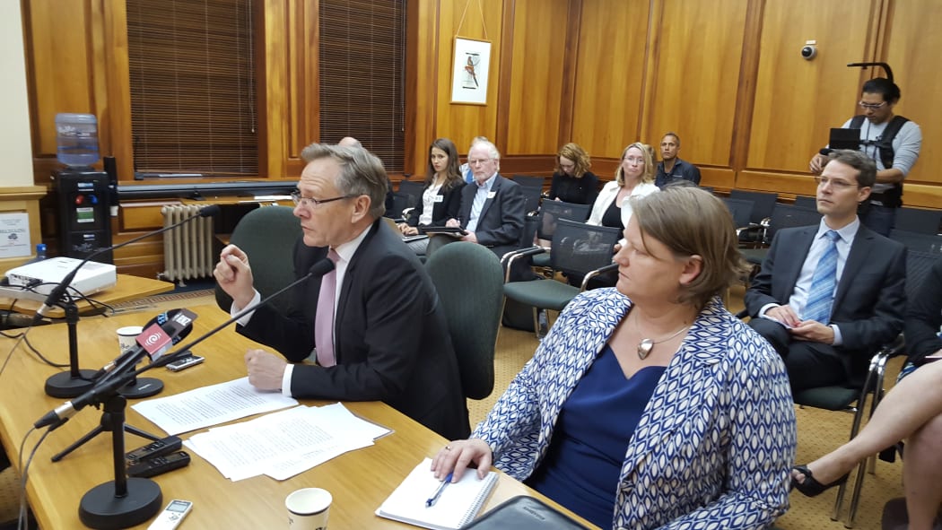 Gerard van Bohemen (right) addressing Parliament's foreign affairs, defence and trade committee and United Nations High Commission divisional manager Bernadette Cavanagh.