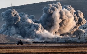 Smoke rises during US-led airstrikes on the Syrian town of Kobane.