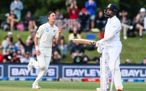 Trent Boult of the Black Caps bowls out Cheteshwar Pujara of India.