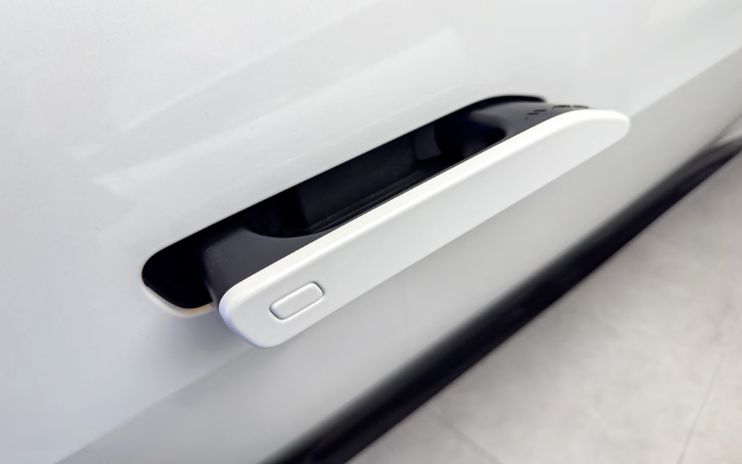 Hidden door handles showcased at Avatr Automotive Experience Center in Yangzhou, Jiangsu, China on November 4, 2025. (Photo by Chen Yang / CFOTO via AFP)