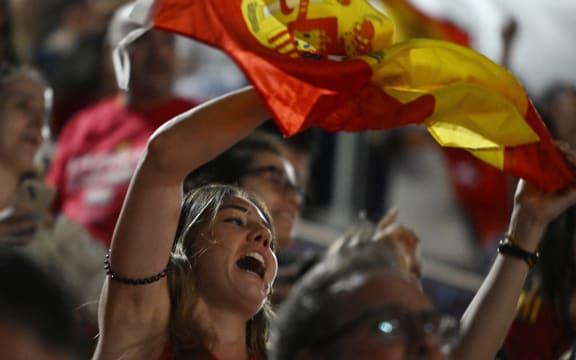 Spain fans celebrate their team's win as they watch a live broadcast of the Women's World Cup final football match between Spain and England, at the Palacio de los Deportes pavilion in Madrid on 20 August 2023.