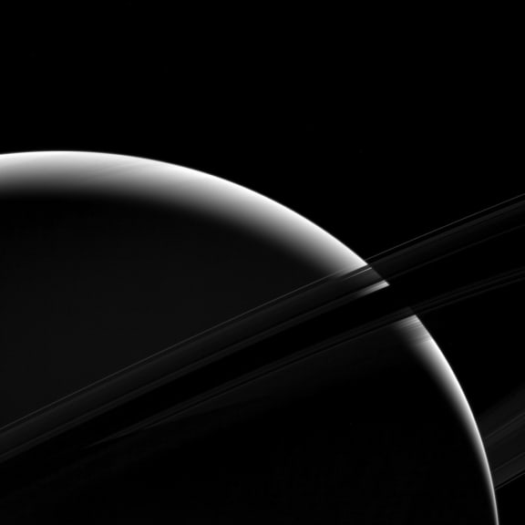 This view looks toward the unilluminated side of the rings from about 7 degrees below the ring plane. The image was taken in green light with the Cassini spacecraft wide-angle camera on Jan. 18, 2017.