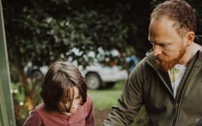 Why Waste founder Leo Murray demonstrating a worm farm.