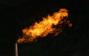 Flare burning off gas and oil at Niagara 1 oil well, West Coast.