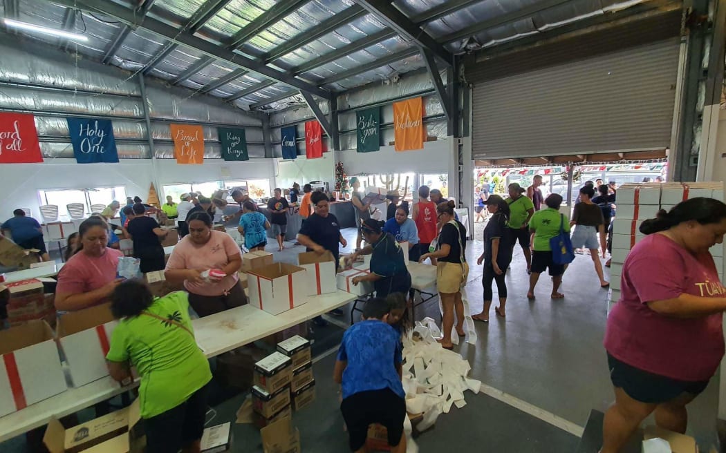 Team packing boxes with goods.