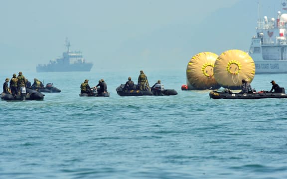 Dive crews at the site of the ferry disaster.