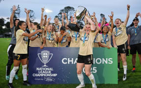 Auckland United FC players celebrate winning the final of the Women’s National League Championship.