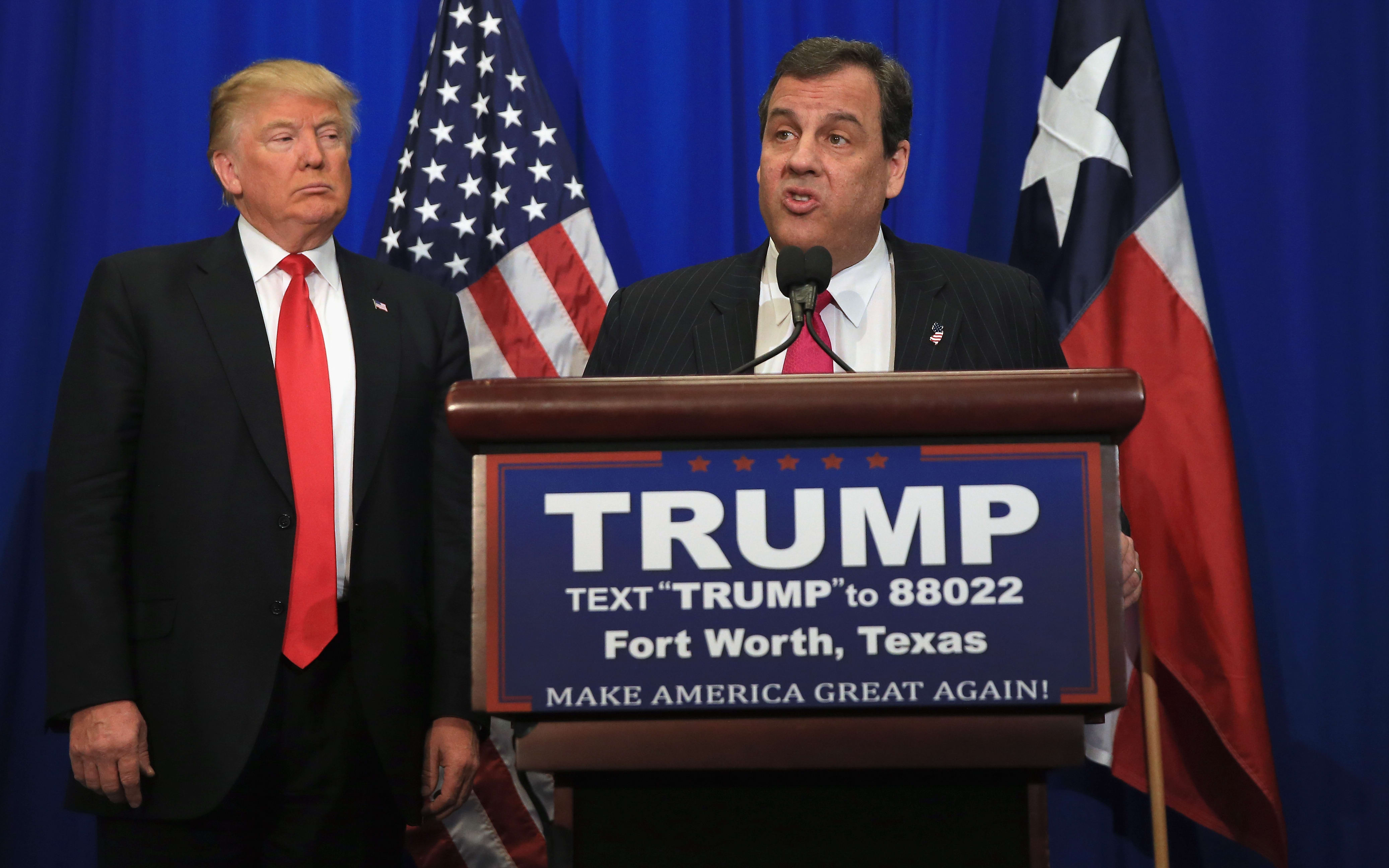 A file photo shows Donald Trump, right, and Chris Christie during a break in the Republican Presidential Candidates' Debate in Manchester, New Hampshire, on 6 February 2016.
