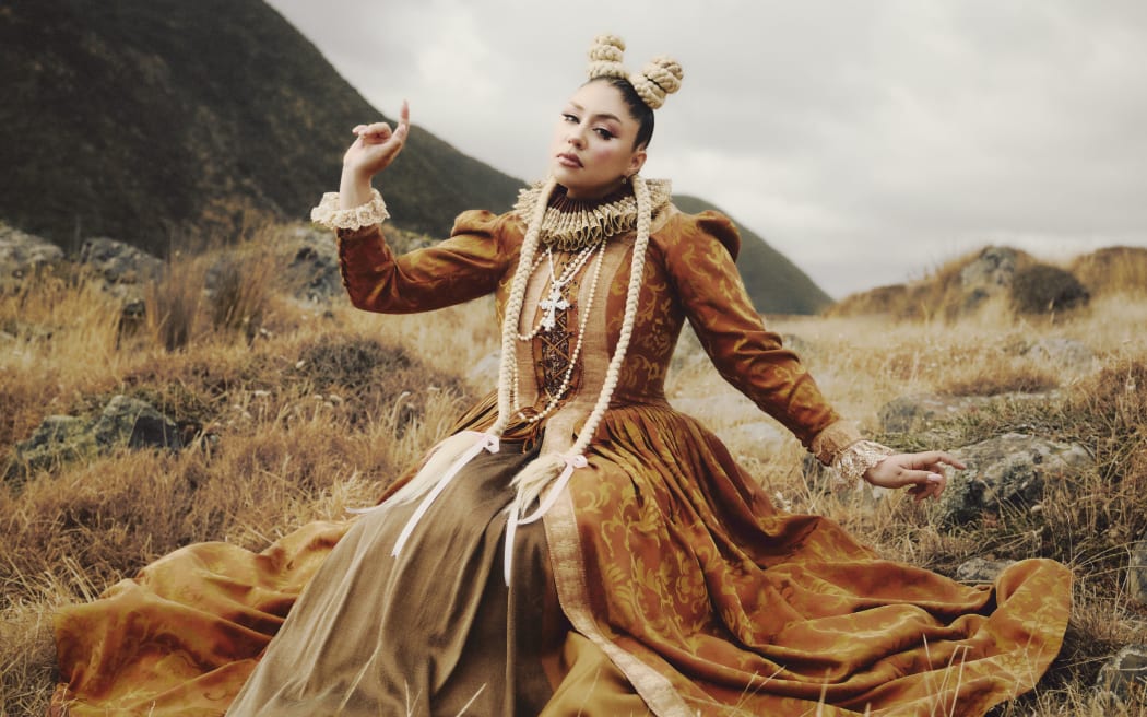 Theia in the BALDH3AD! music video.