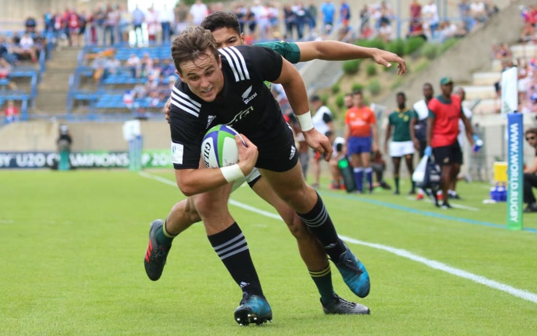 New Zealand centre Harry Plummer scores during the side's loss to South Africa.
