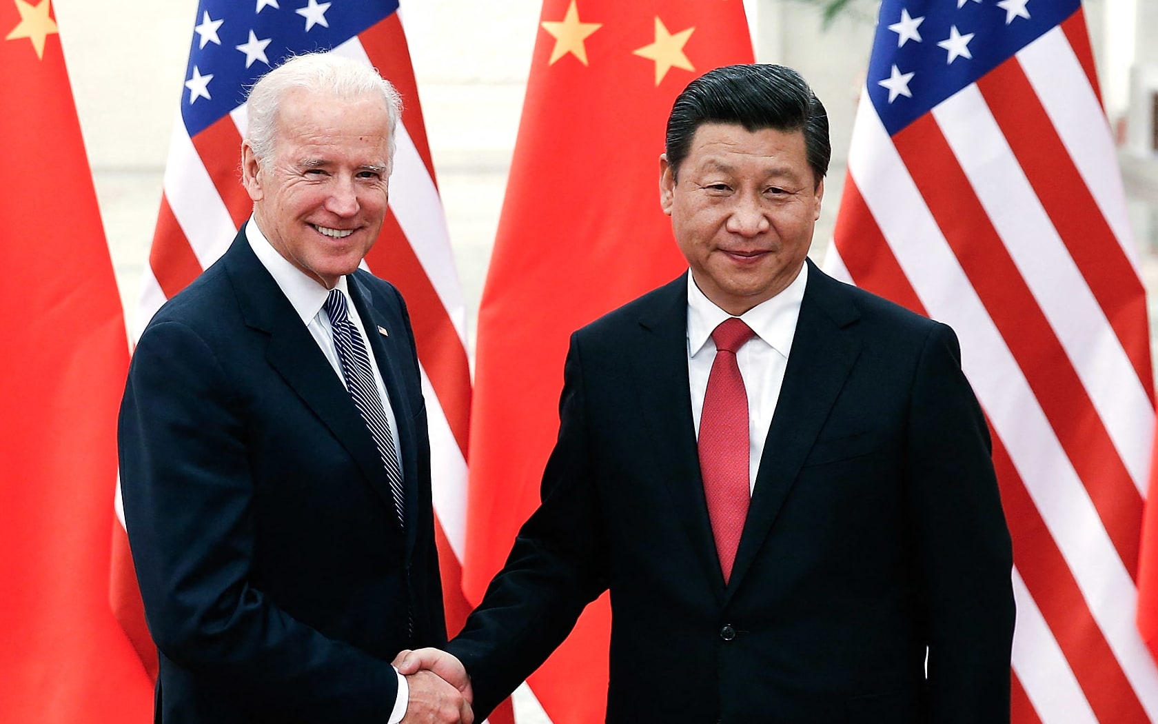 Chinese President Xi Jinping (right) shakes hands with US Vice President Joe Biden inside the Great Hall of the People in Beijing in December, 2013.