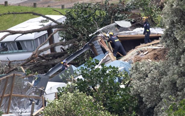 Officials work at the scene of todays landslide at the Beachside Holiday Park in Mt Maunganui.
22 January 2026 Photograph by Alan Gibson.