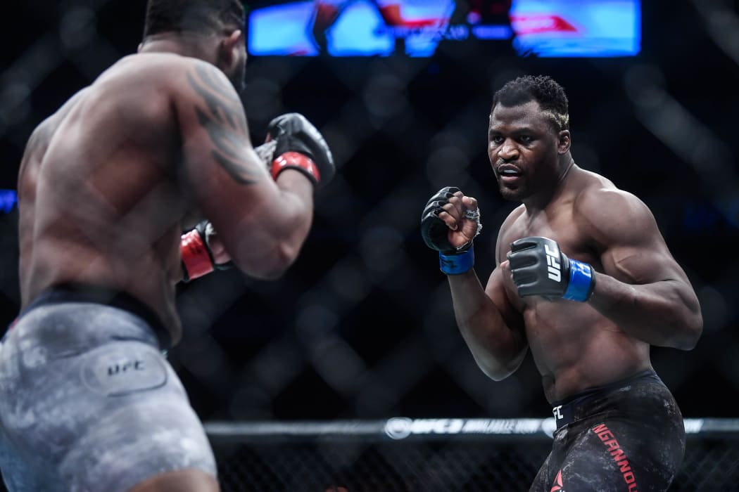 Francis Ngannou of Cameroon and France (blue gloves)  fights Curtis Blaydes of America (red gloves) during the UFC Fight Night at Cadillac Arena in Beijing, China, 24 November 2018.