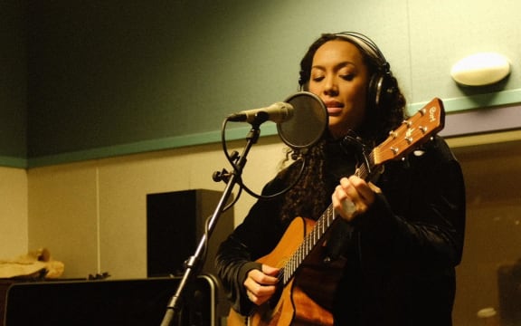 Wellington musician AJA performing in RNZ's Wellington studio