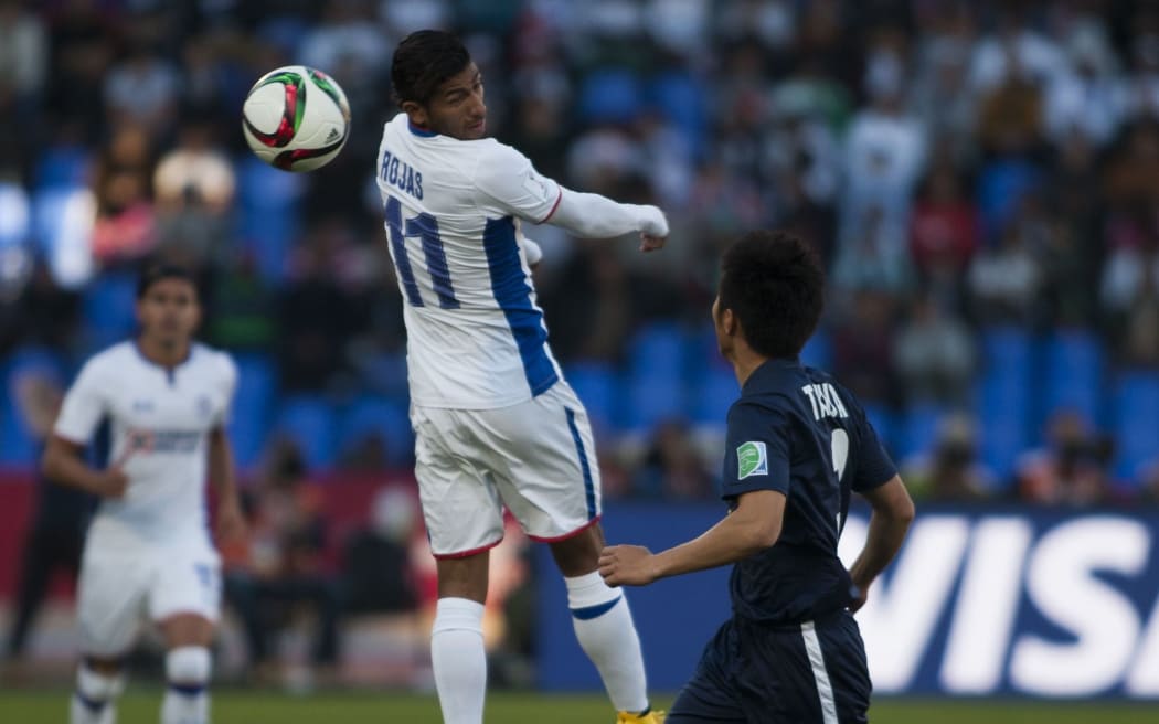 Akuya Iwata (R) of Auckland City in action against Joao Rojas (L) of Cruz Azul.