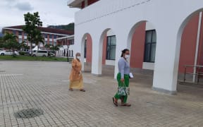 Women in Samoa wearing masks to protect themselves from measles.