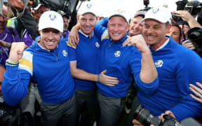 Europe's Rory McIlroy, Stephen Gallagher, Jamie Donaldson and Henrik Stenson celebrate after winning the Ryder Cup. 2014.