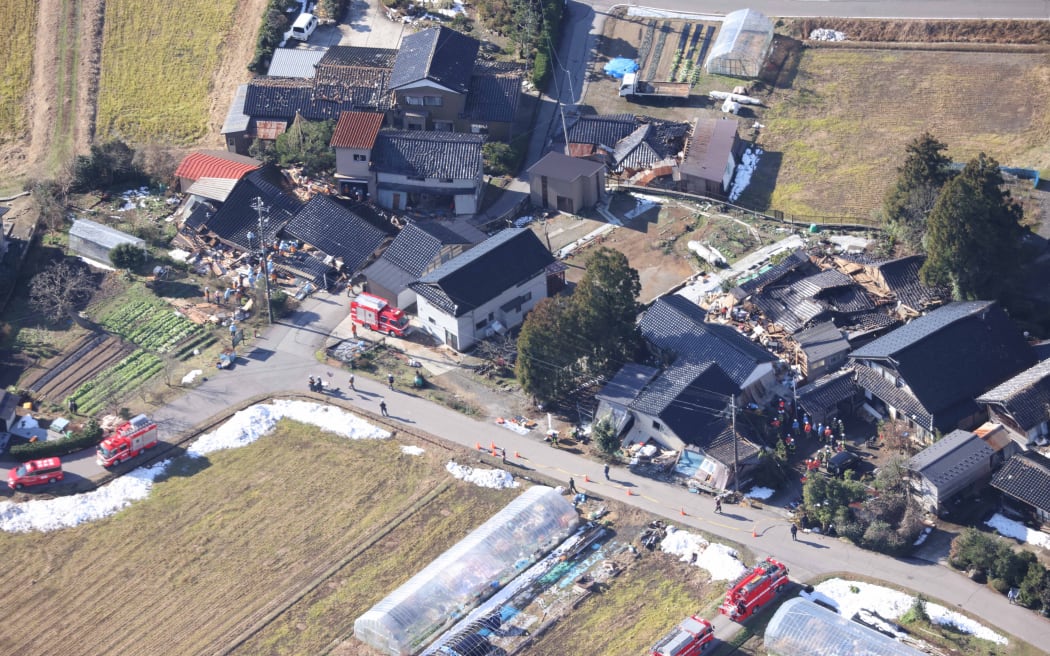 An aerial photo shows a search conducted at collapsed houses in Suzu City, Ishikawa Prefecture on 4 January, 2024 after a strong earthquake struck Japan's Noto region on New Year's Day.