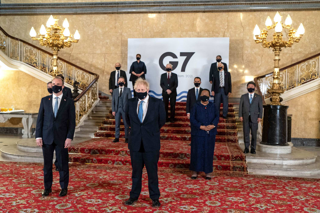 A handout picture released by the European Commission of family photograph with other delegates during the G7 foreign ministers meeting in London on May 5, 2021.
