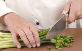 Chef cuts spring onions
