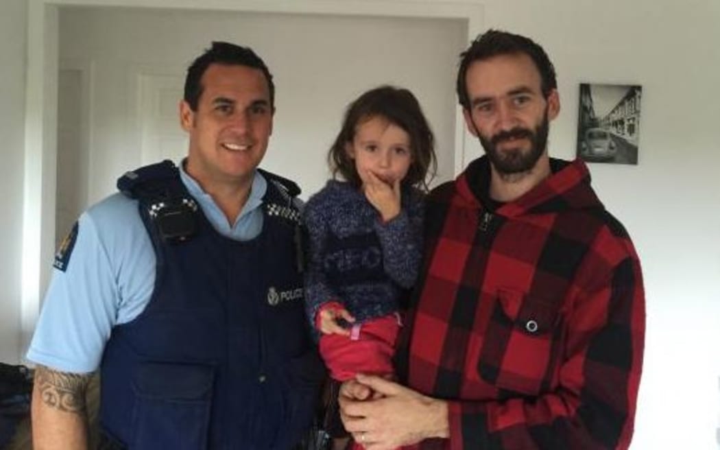 Sergeant Craig Curnow, left, with four-year-old Hailey Alver and father Chris Alver.