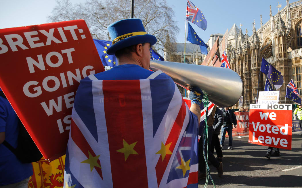 Anti-Brexit activist Steve Bray (L) demonstrates outside the Houses of Parliament in central London on February 27, 2019