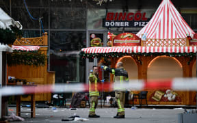 Emergency services personnel on 21 December 2024, still working at the Christmas market in Magdeburg city the morning after a car fatally crashed into a crowd.