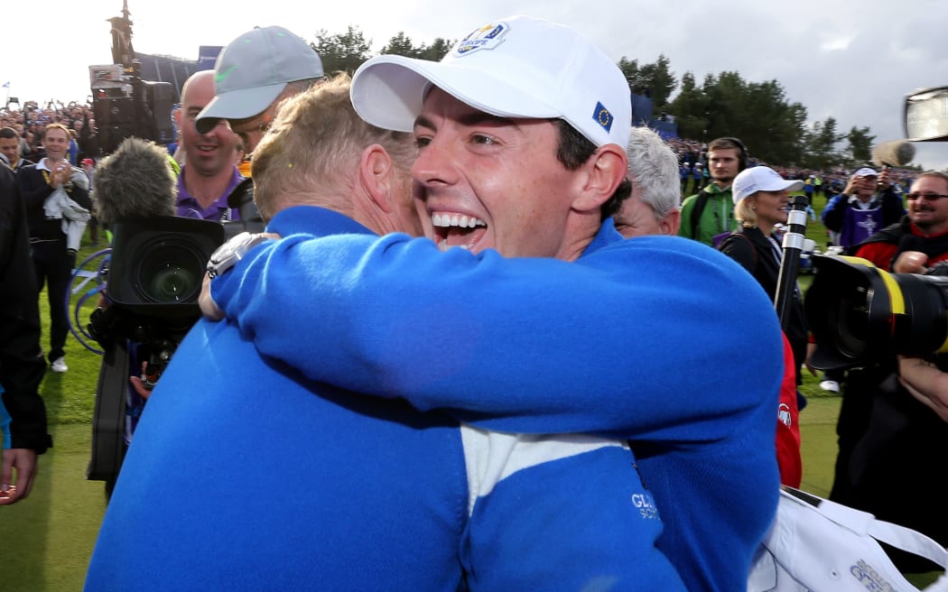 Europe's Jamie Donaldson and Rory McIlroy celebrate on the 16th green after winning the Ryder Cup. 2014.