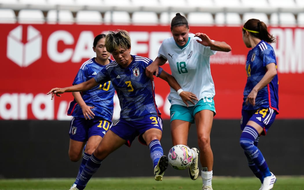 Grace Jale of New Zealandis stopped by Moeka Minami of Japan in the Women’s International Friendly soccer match at Estadio Nueva Condomina, Murcia, Spain on 3 June, 2024.