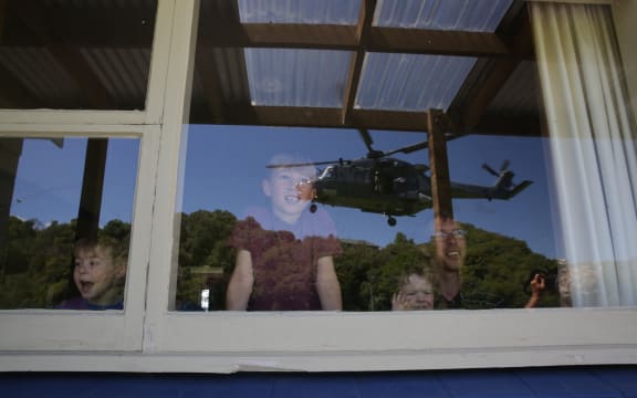 A Defence helicopter nears the home of a Kaikoura Family