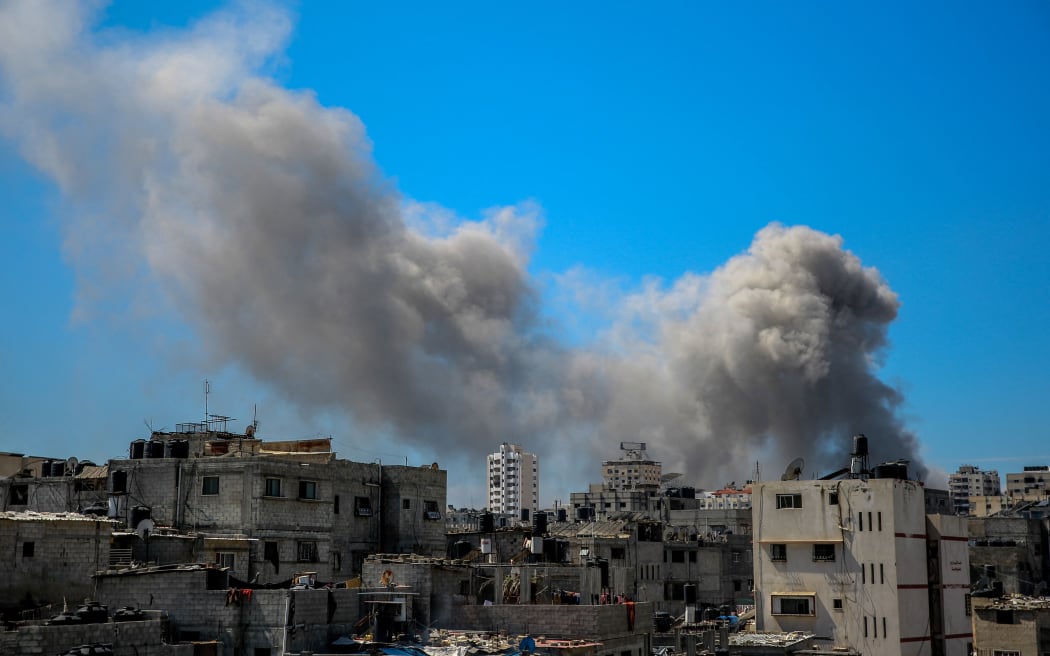 A picture shows smoke billowing after Israeli bombardment in the vicinity of the Al-Shifa hospital in Gaza City on March 23, 2024, amid ongoing battles between Israel and the militant group Hamas. (Photo by AFP)