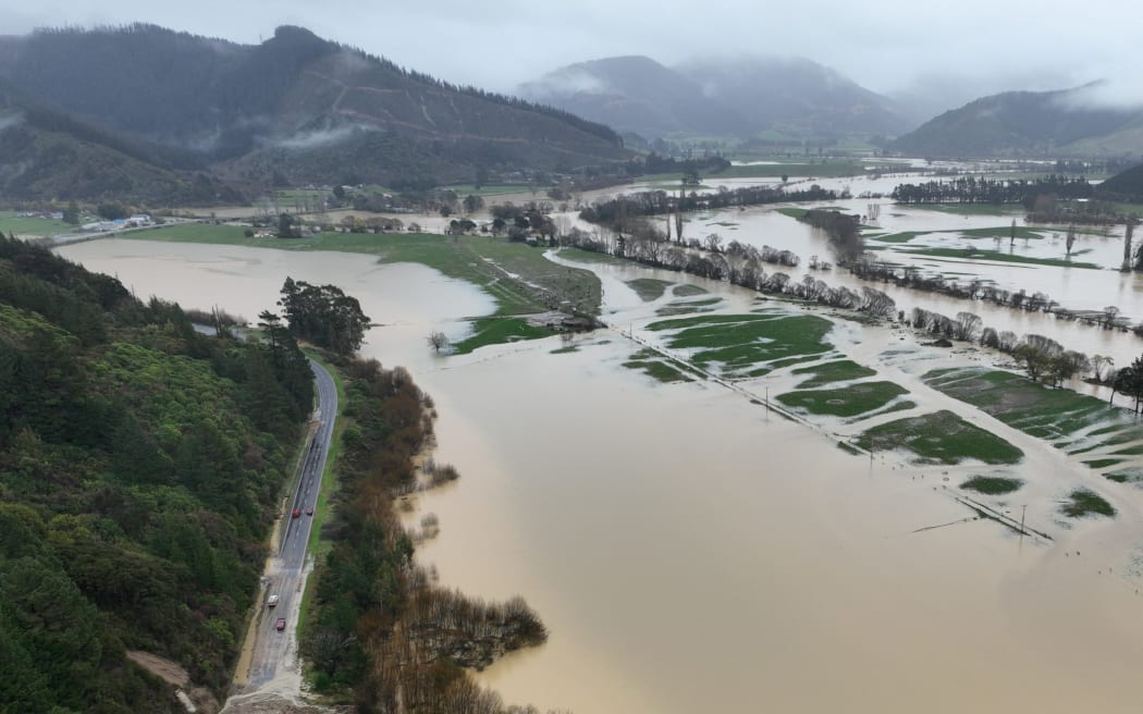 An aerial photograph of damage to State Highway 6 and flooded paddocks at Canvastown.