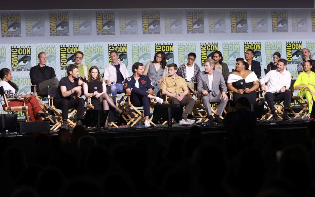 SAN DIEGO, CALIFORNIA - JULY 26: (L-R) Yvette Nicole Brown, Patrick Mckay, Charlie Vickers, JD Payne, Morfydd Clark, Daniel Weyman, Benjamin Walker, Megan Richards, Robert Aramayo, Tyroe Muhafidin, Charles Edwards, Maxim Baldry, Sophia Nomvete, Ismaël Cruz Córdova, Ema Horvath, Lloyd Owen, Trystan Gravelle and Cynthia Addai-Robinson speak onstage during "The Lord Of The Rings: Rings Of Power" Panel during 2024 Comic-Con International at San Diego Convention Center on July 26, 2024 in San Diego, California.   Matt Winkelmeyer/Getty Images/AFP (Photo by Matt Winkelmeyer / GETTY IMAGES NORTH AMERICA / Getty Images via AFP)