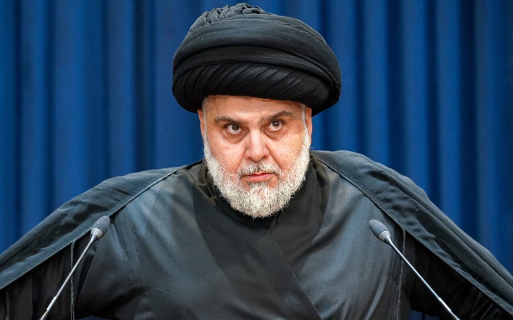 Shiite Muslim cleric Moqtada Sadr gives a speech in Iraq's central holy shrine city of Najaf on August 30, 2022. - Iraqi supporters of powerful cleric Moqtada Sadr began withdrawing from Baghdad's Green Zone on August 30 after he demanded fighting end between rival Shiite forces and the army that left 23 dead and hundreds wounded. (Photo by Qassem al-KAABI / AFP)