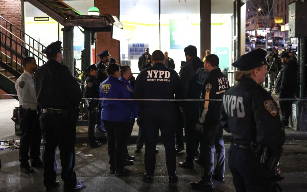 Police are seen at the Mt. Eden Avenue subway station in the Bronx borough of New York after six people were injured with one person in critical condition following a shooting at the subway station on February 12, 2024 in New York City. Authorities were alerted just after 4:30 pm (2130 GMT) and one patient in a critical condition was taken to the hospital, as were four people in serious condition and one with minor injuries, the fire department said. No motive was given for the shooting. (Photo by CHARLY TRIBALLEAU / AFP)